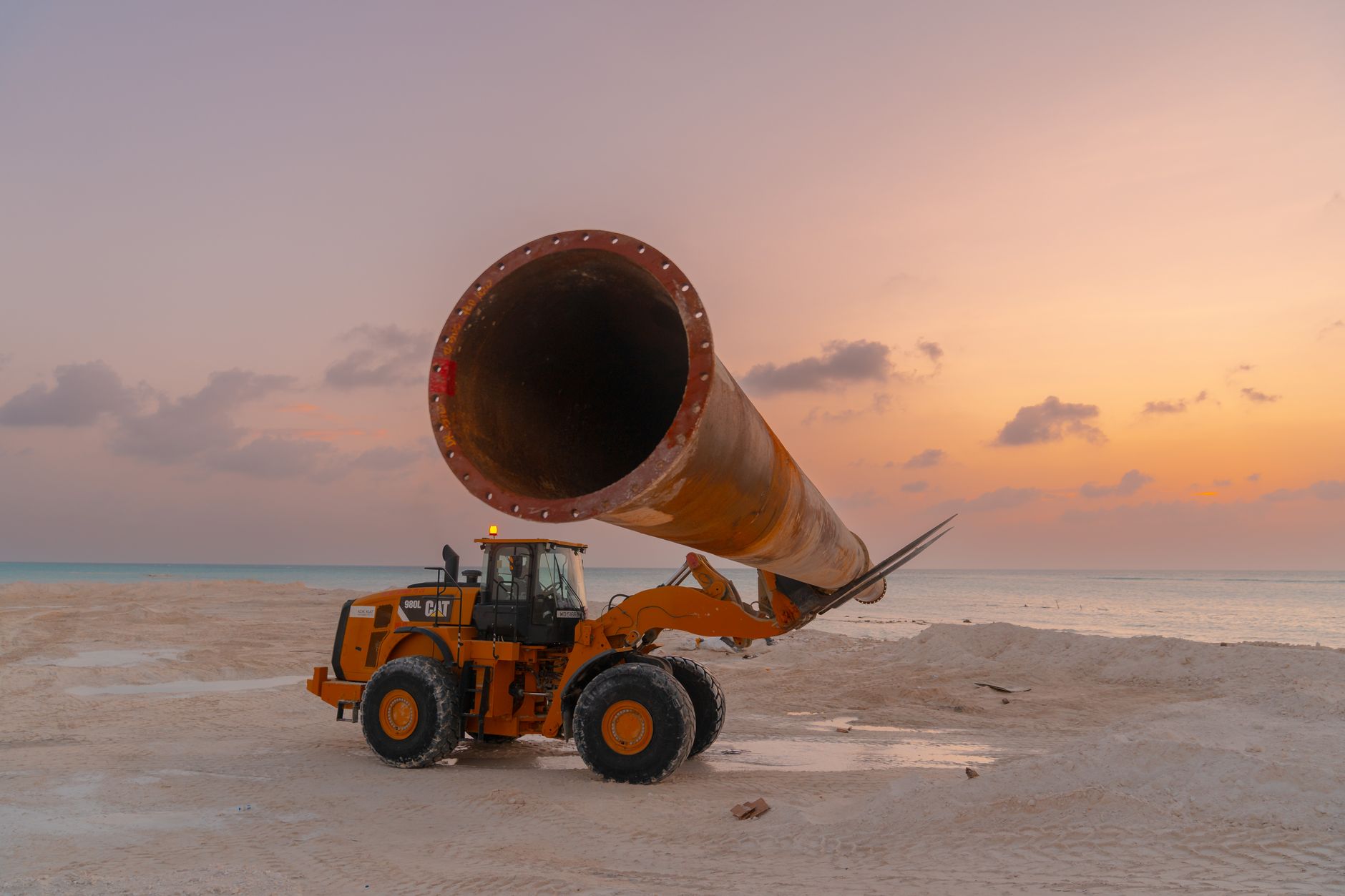 Workers constructing an underground pipeline in a rural corridor