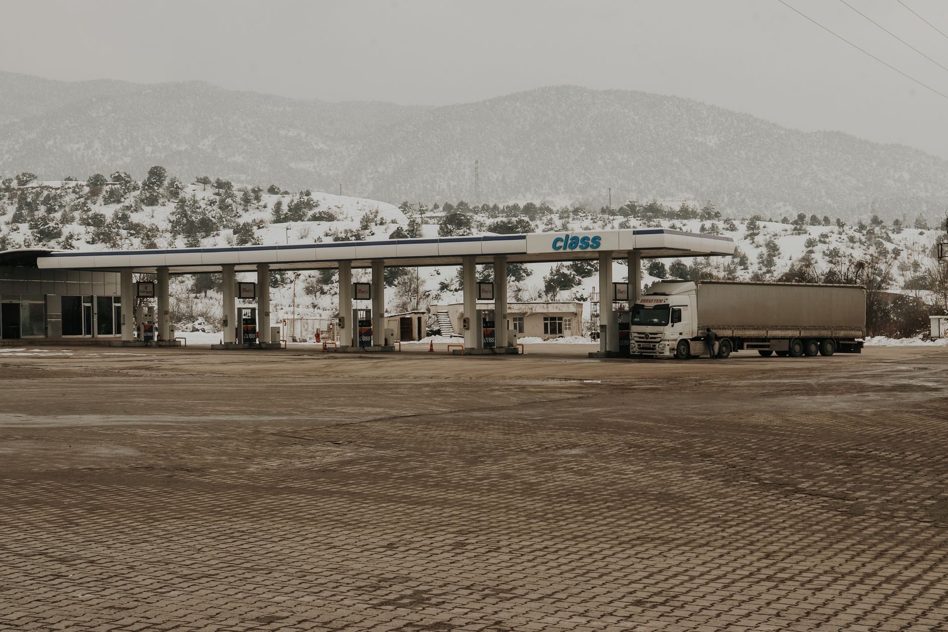 Heavy diesel trucks transporting freight along a major highway corridor